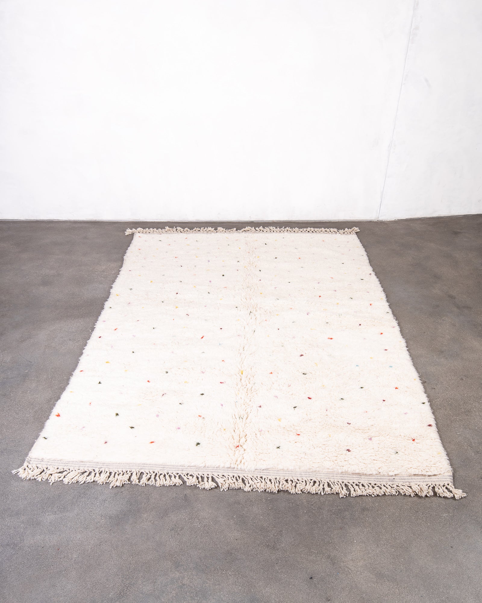 Modern, designer, handcrafted Berber rug from Morocco. Beniourain carpet with beautiful colours and patterns and fluffy wool texture.